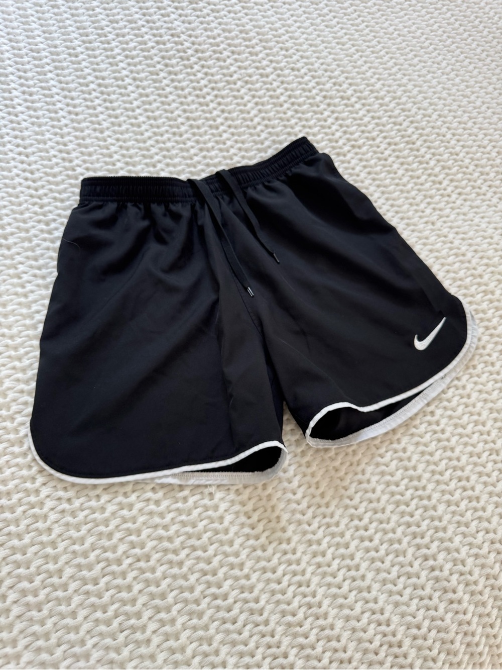 Nike Black Woman’s Athletic Shorts with White Trim Swoosh